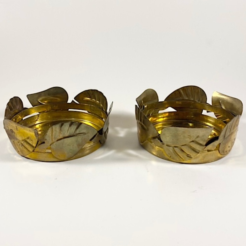 Pair of round brass candle holders